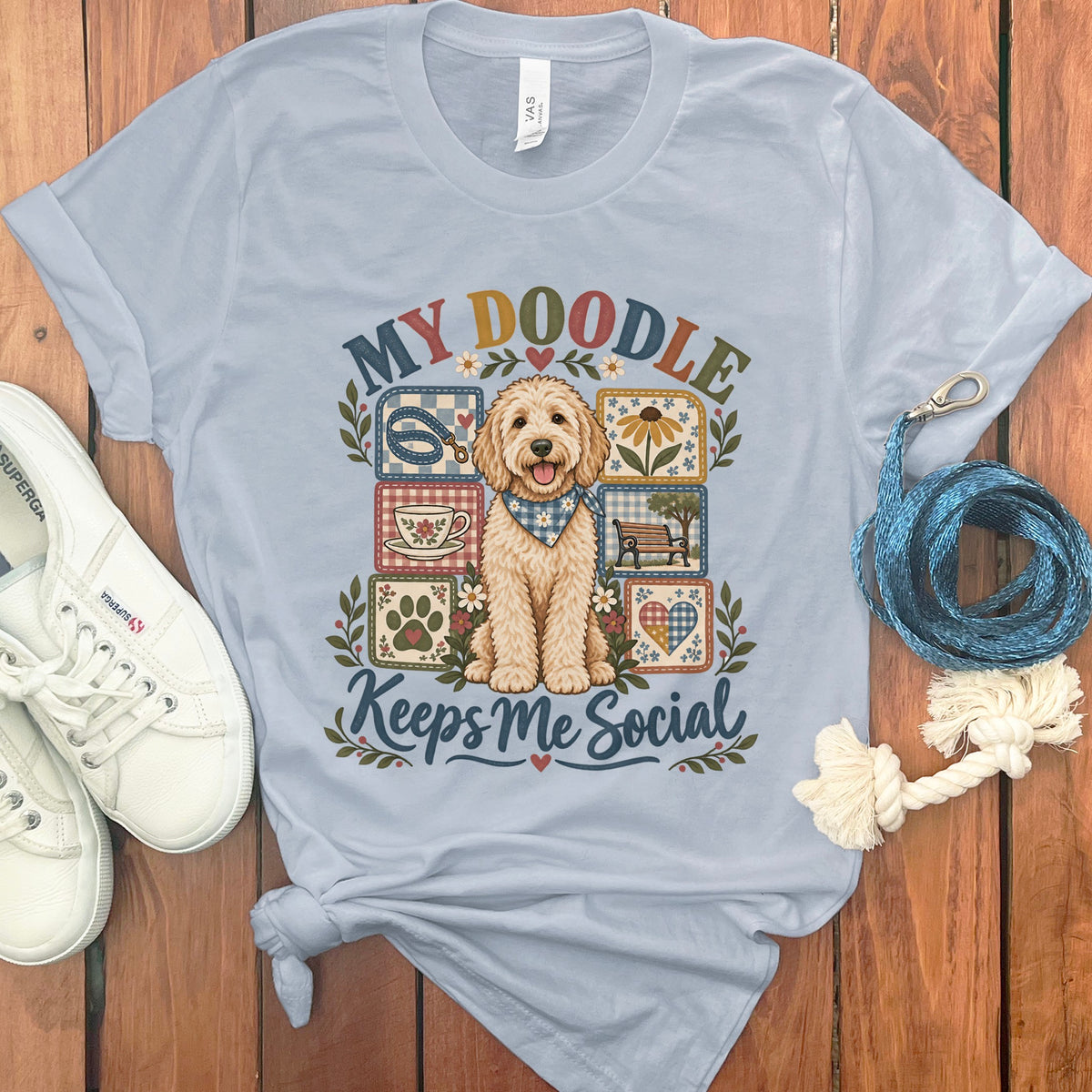 Light blue t-shirt with a doodle dog design and text "MY DOODLE Keeps Me Social".