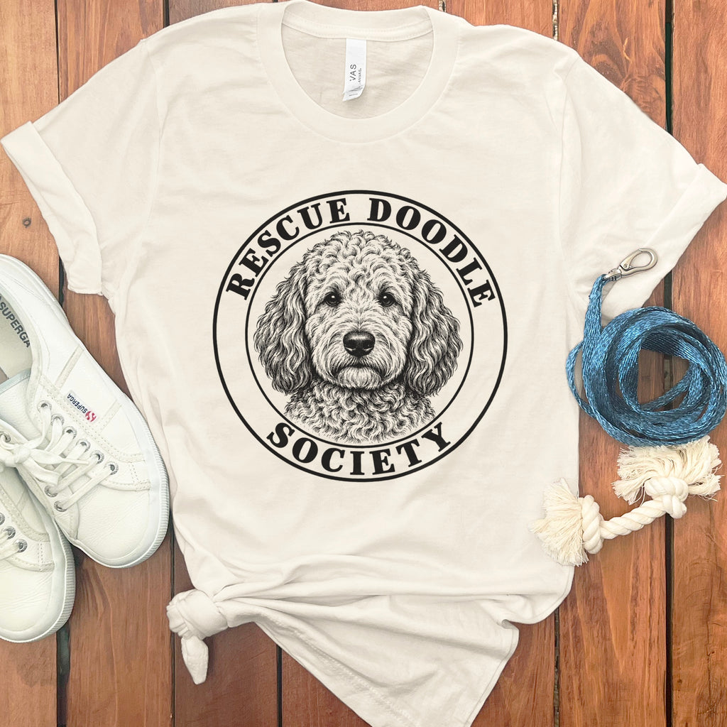 Cream t-shirt with "Rescue Doodle Society" logo featuring a doodle dog.