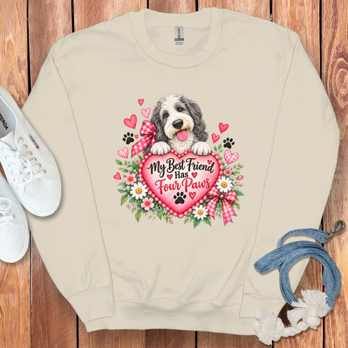 Beige crewneck sweatshirt featuring a graphic of a fluffy dog behind a heart with text My Best Friend Has Four Paws.
