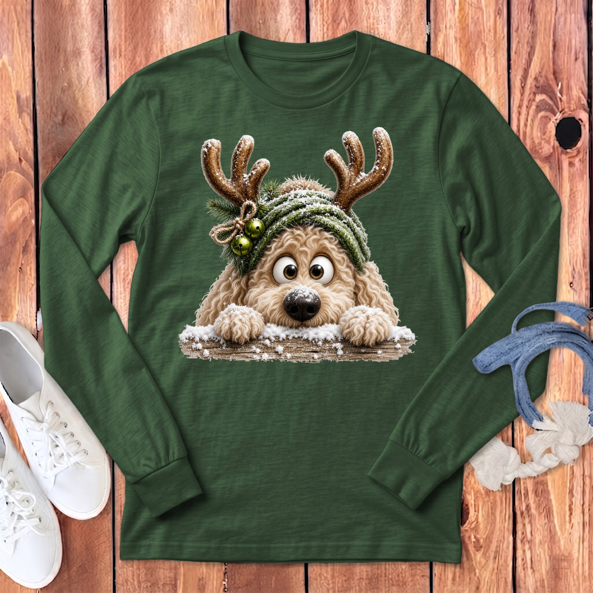 Green long-sleeve shirt with a fluffy dog wearing reindeer antlers and a hat.