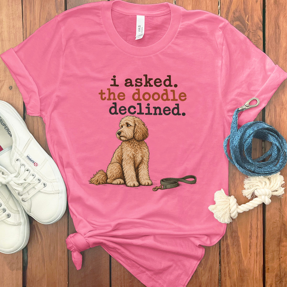 Pink t-shirt with "i asked. the doodle declined." and a doodle dog.