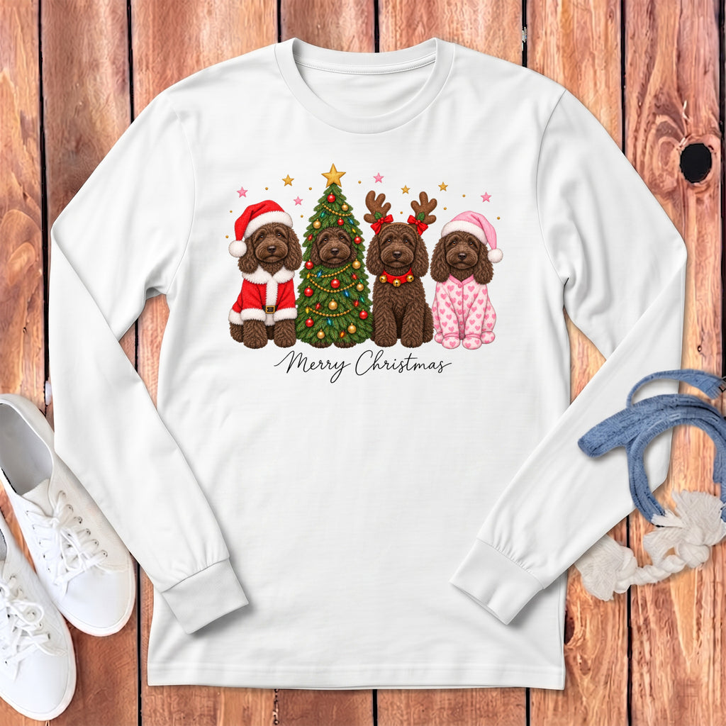 A white long-sleeved shirt features a graphic of four brown dogs celebrating Christmas with a tree and the text Merry Christmas.