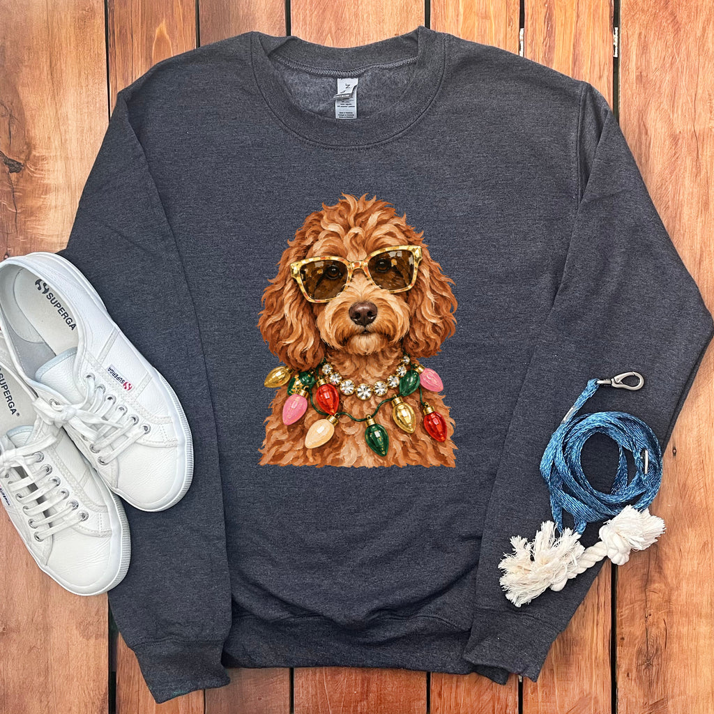 Dark gray sweatshirt with a brown poodle wearing sunglasses and a string of colorful lights.