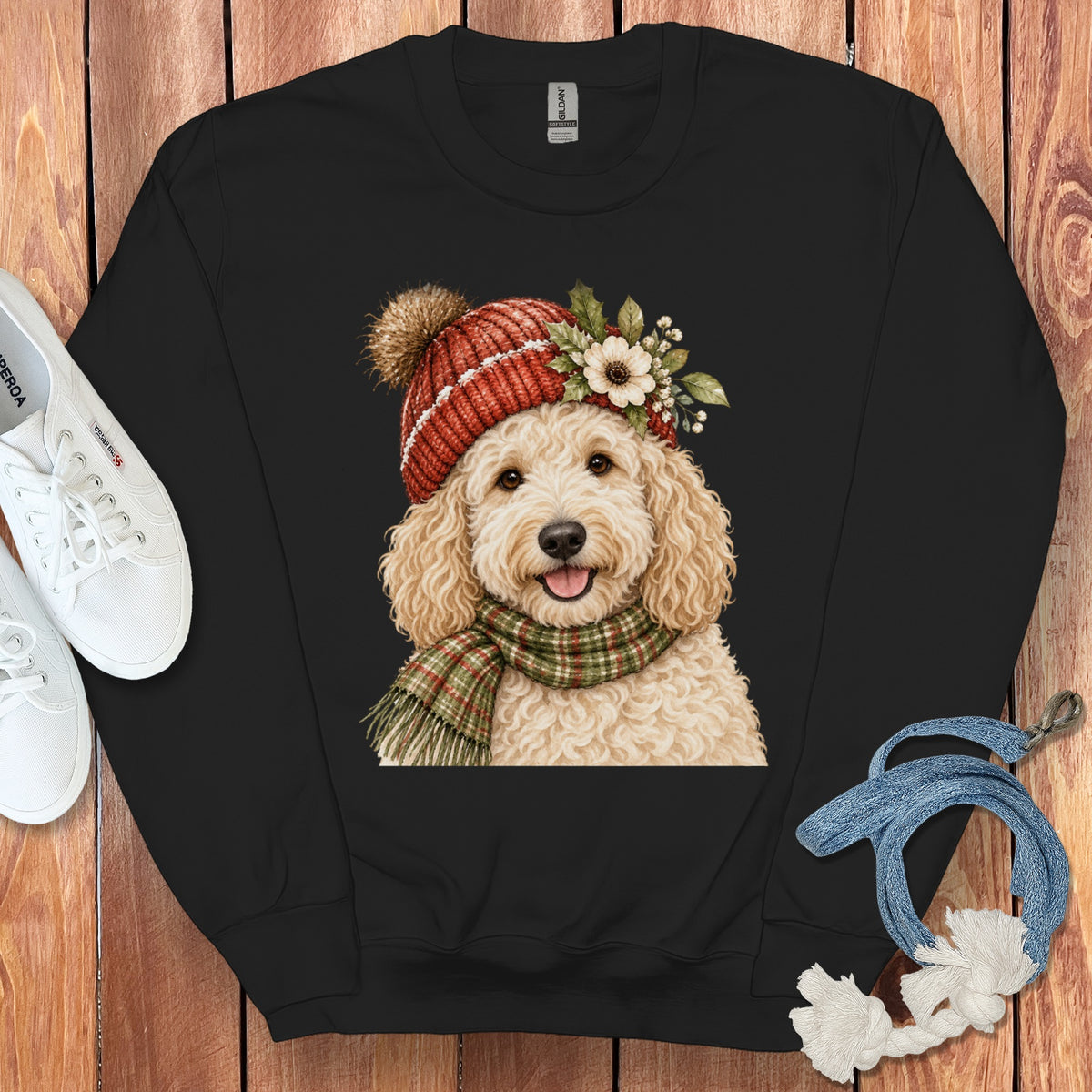 Black sweatshirt with illustration of a goldendoodle wearing a hat and scarf.