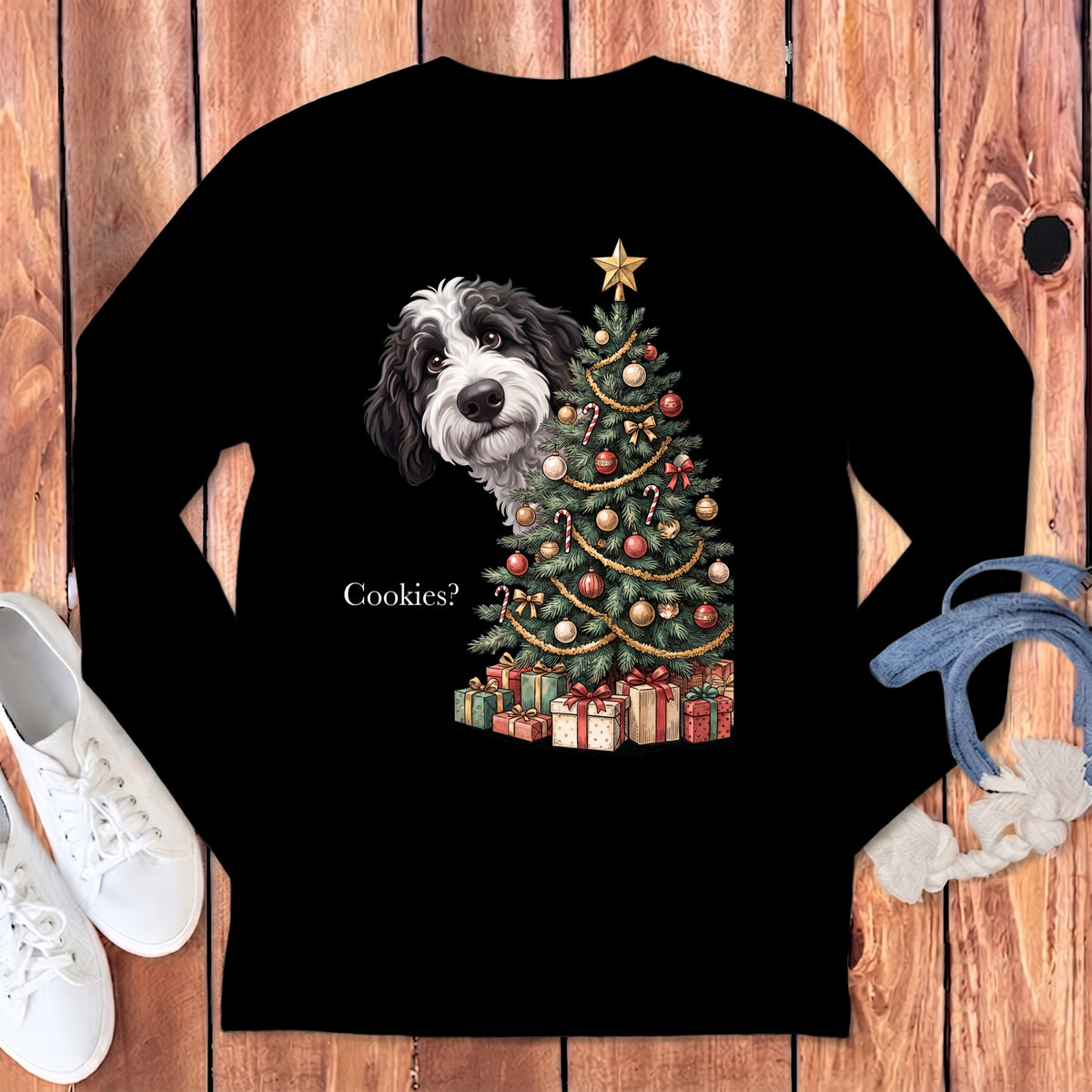 Black long-sleeve shirt with a dog peeking behind a Christmas tree and the text "Cookies?".