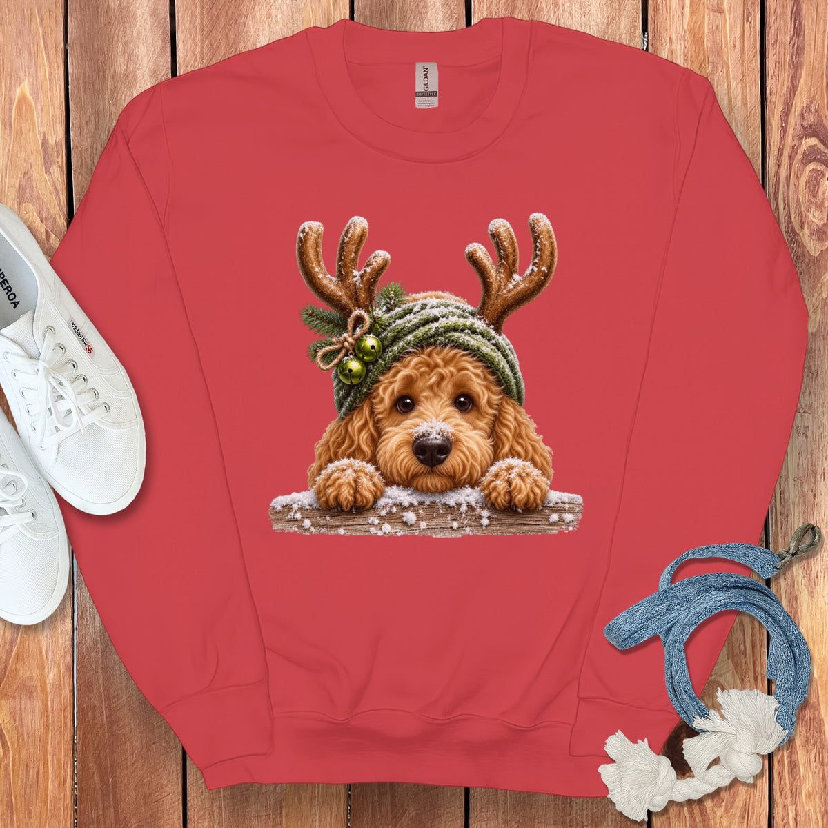 Red sweatshirt with a festive dog wearing antlers and a hat graphic.
