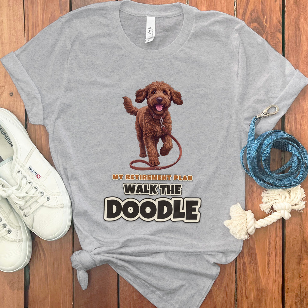 Grey t-shirt with a brown doodle dog and text "My Retirement Plan Walk the Doodle".