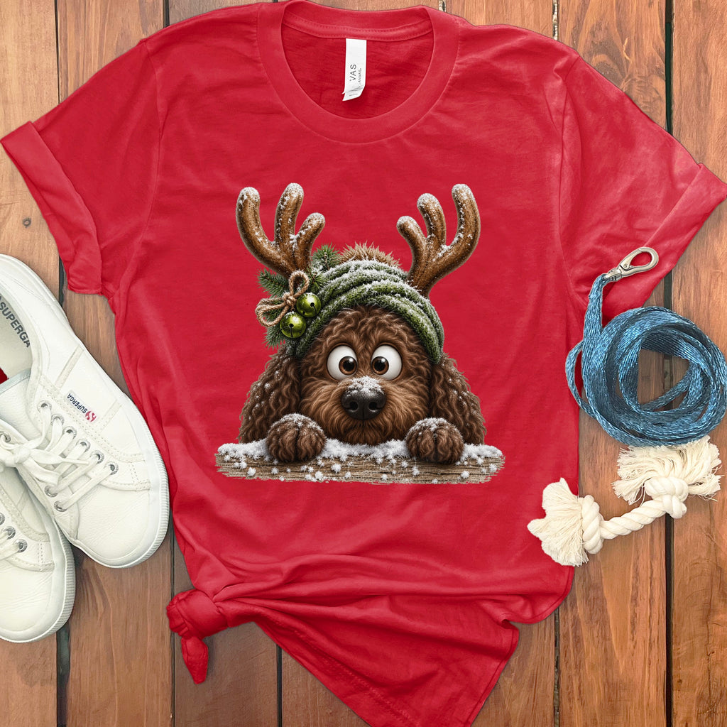 Red t-shirt with a fuzzy brown dog wearing antlers and a green hat.