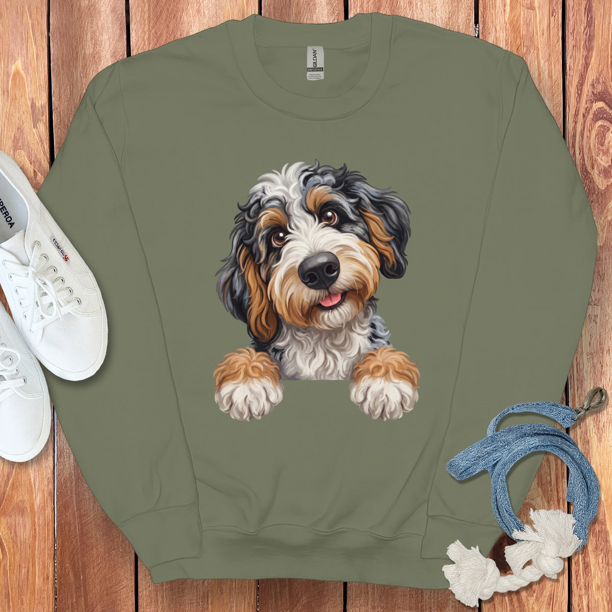 Green sweatshirt with a colorful Bernese Mountain Dog puppy graphic and white sneakers.