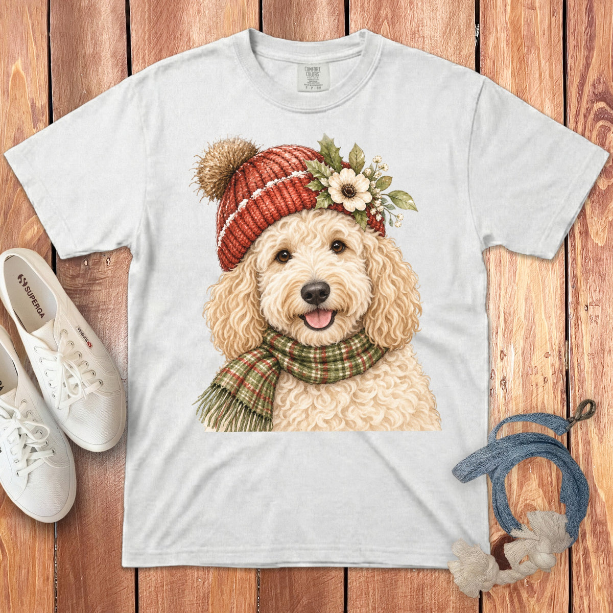 White t-shirt with watercolor doodle wearing a red hat and plaid scarf.