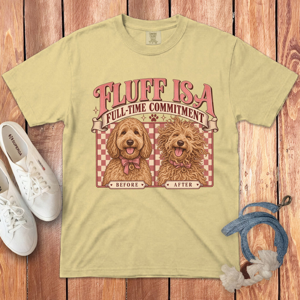 A yellow t-shirt with retro pink text reading Fluff Is a Full-Time Commitment, featuring before and after illustrations of a fluffy dog.