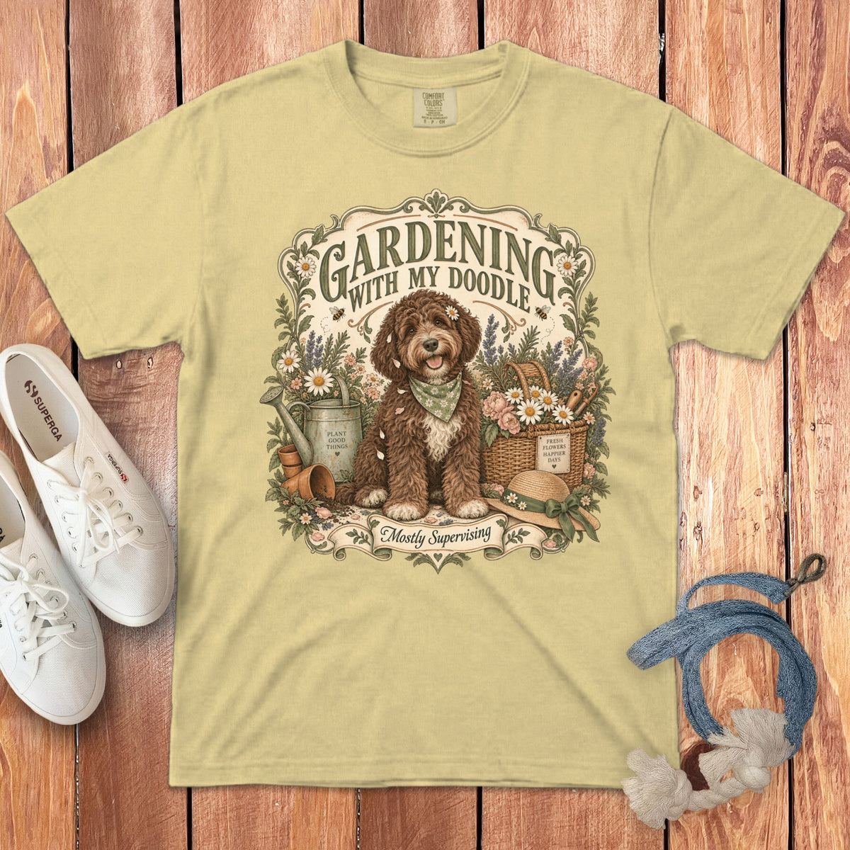 Light yellow t-shirt with "Gardening with my doodle" and doodle dog illustration.