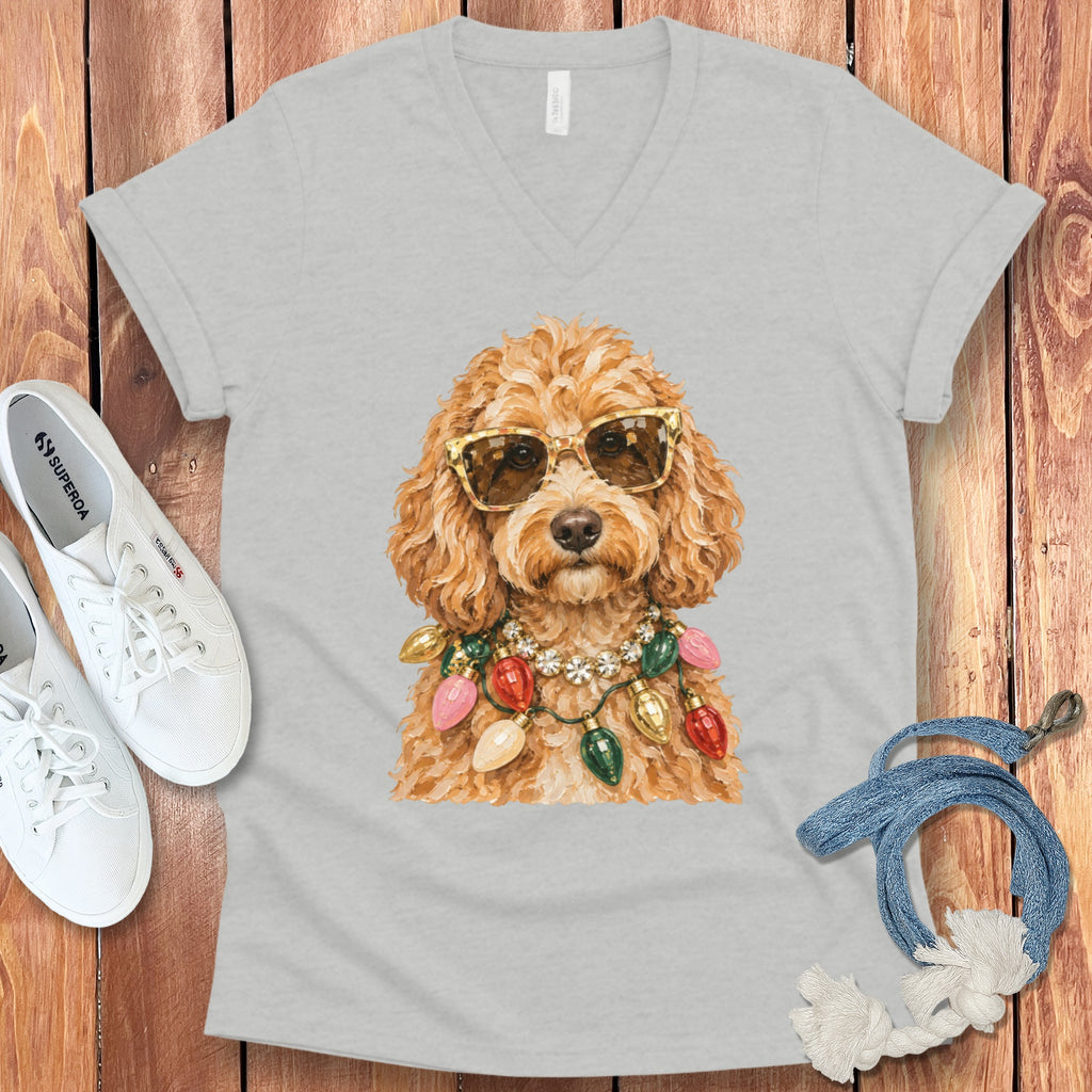 Light gray v-neck t-shirt with gold-accented sunglasses and Christmas lights.