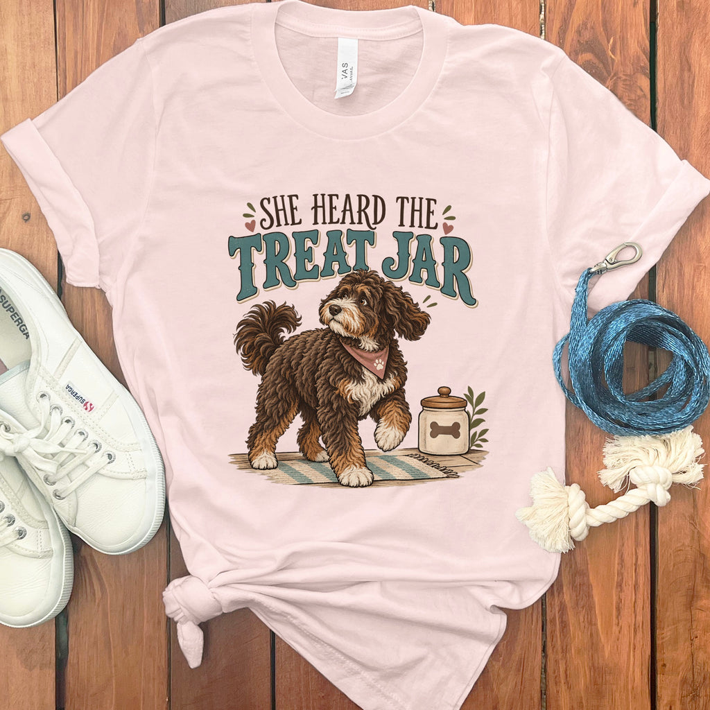 Pink t-shirt with cartoon dog and text "SHE HEARD THE TREAT JAR".