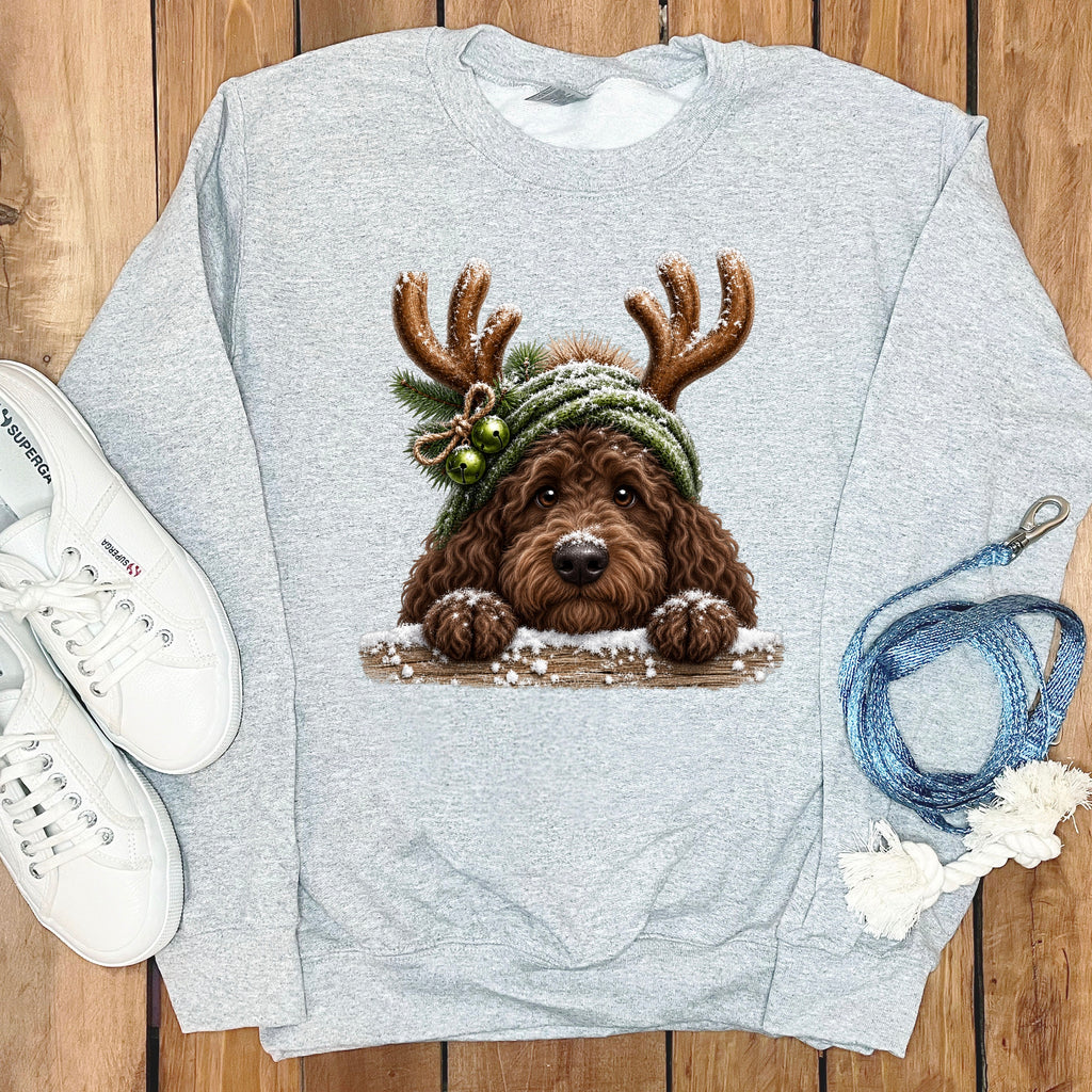Gray sweatshirt with a doodle dog wearing antlers and a Santa hat.