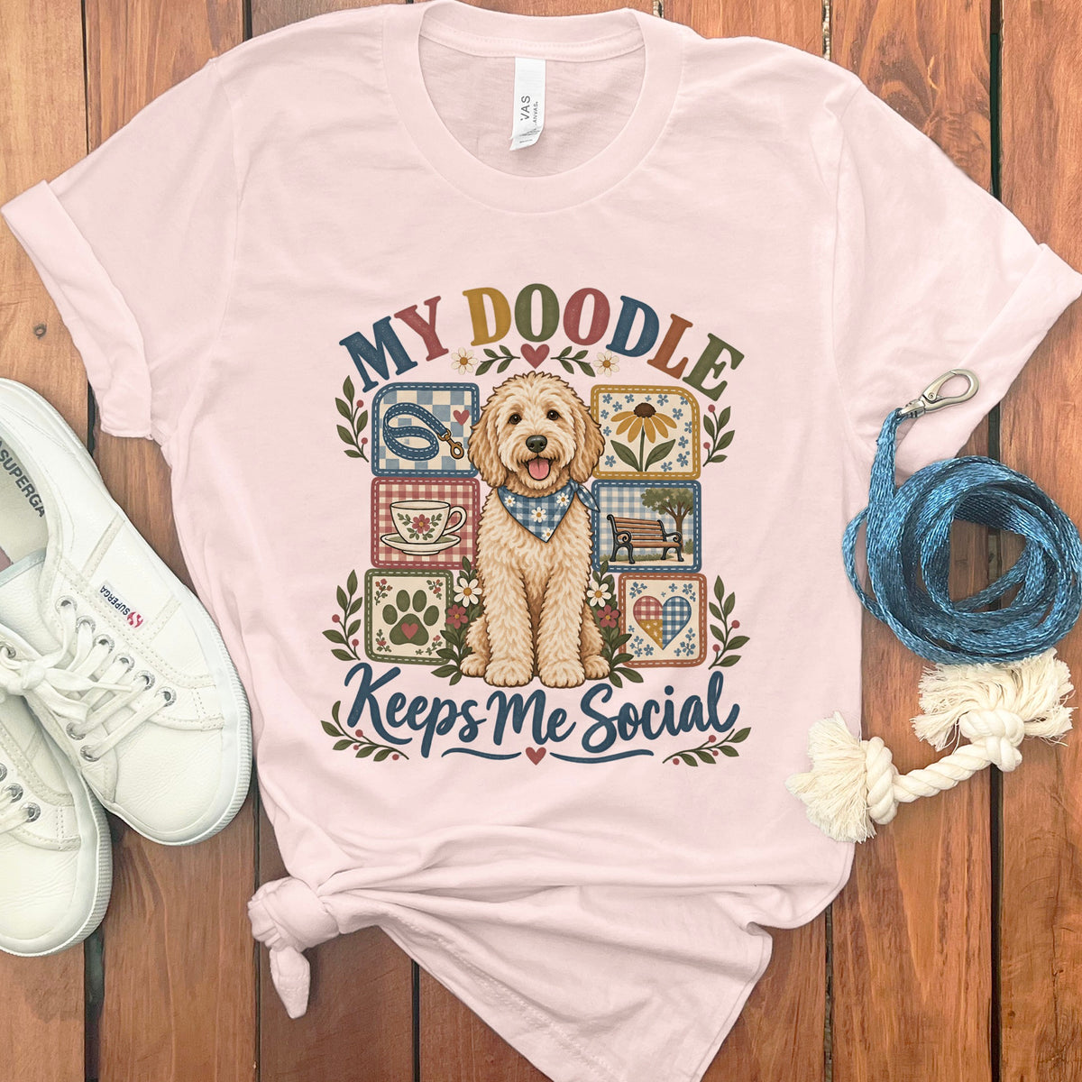 Pink t-shirt with a doodle dog graphic and text "MY DOODLE Keeps Me Social".