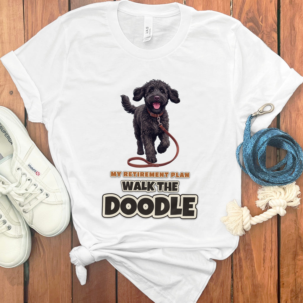 White t-shirt with black doodle graphic and text "My Retirement Plan Walk the Doodle".