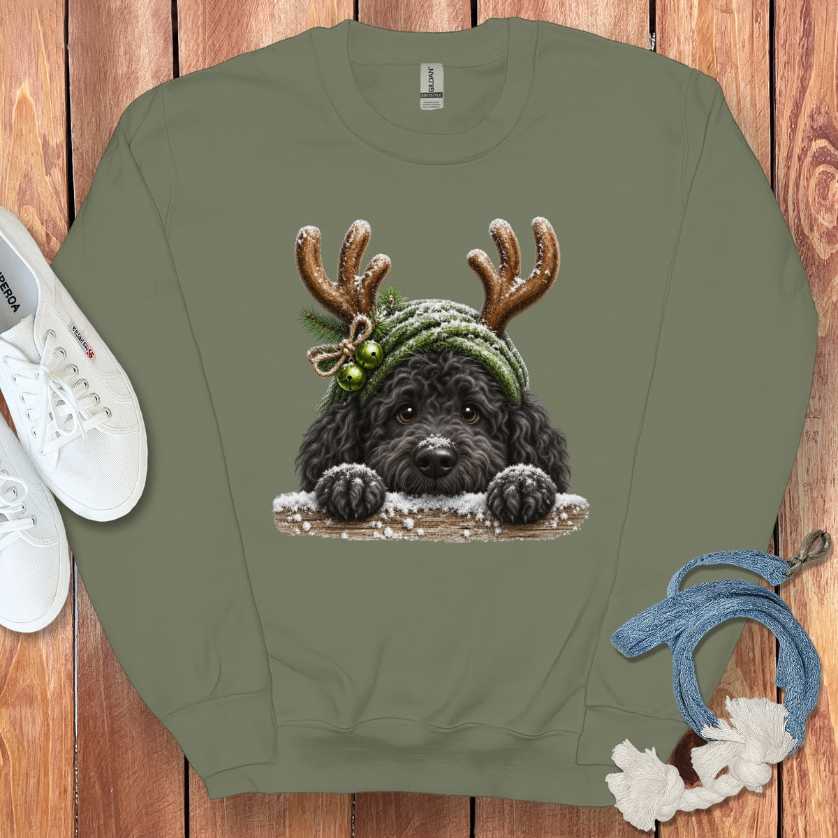 Green sweatshirt with a black poodle wearing antlers and a green hat.