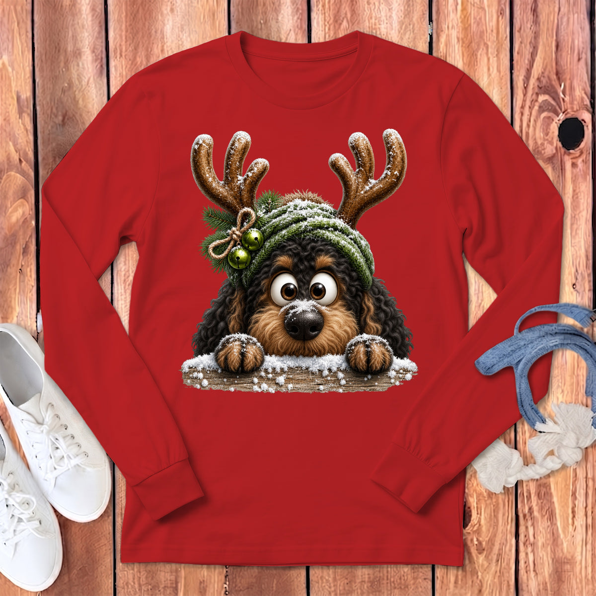 Red long sleeve shirt with cartoon dog wearing antlers and a winter hat.