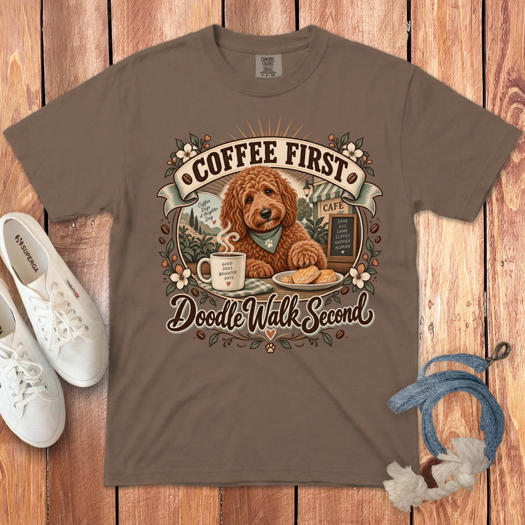Brown t-shirt with "Coffee First, Doodle Walk Second" graphic featuring a doodle dog, coffee cup, and cafe.