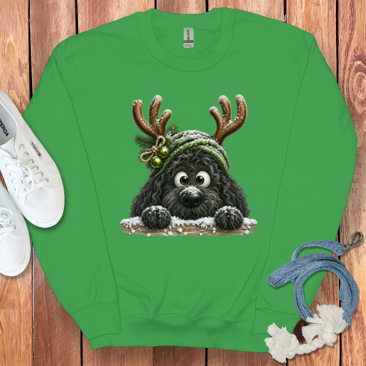 Green sweatshirt with a cartoon black dog wearing antlers and a green hat.