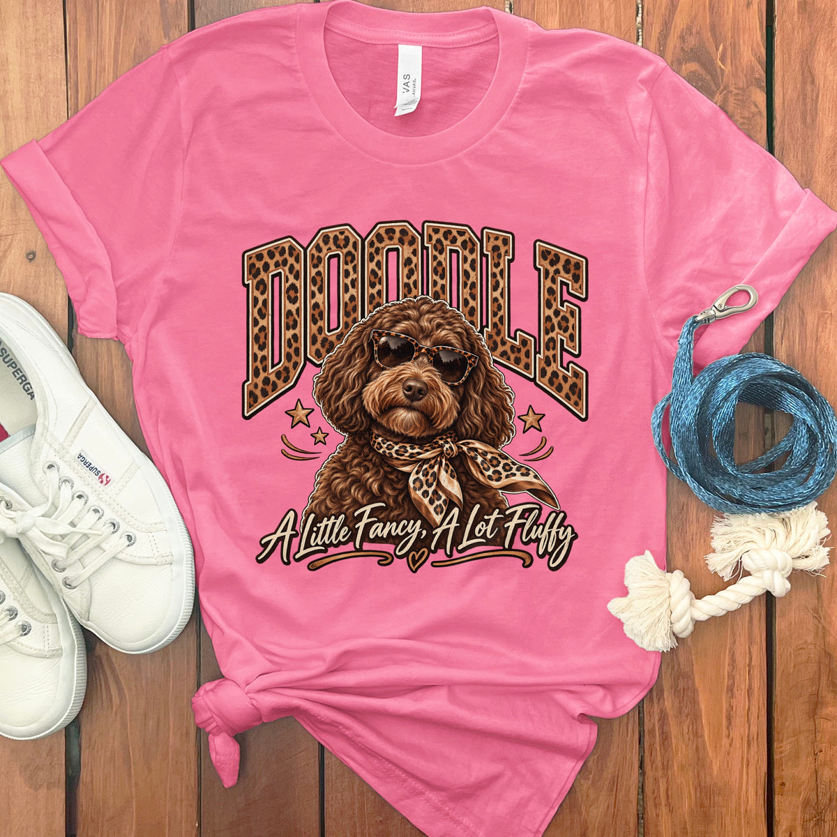Pink t-shirt with a doodle dog wearing sunglasses and a leopard print scarf.