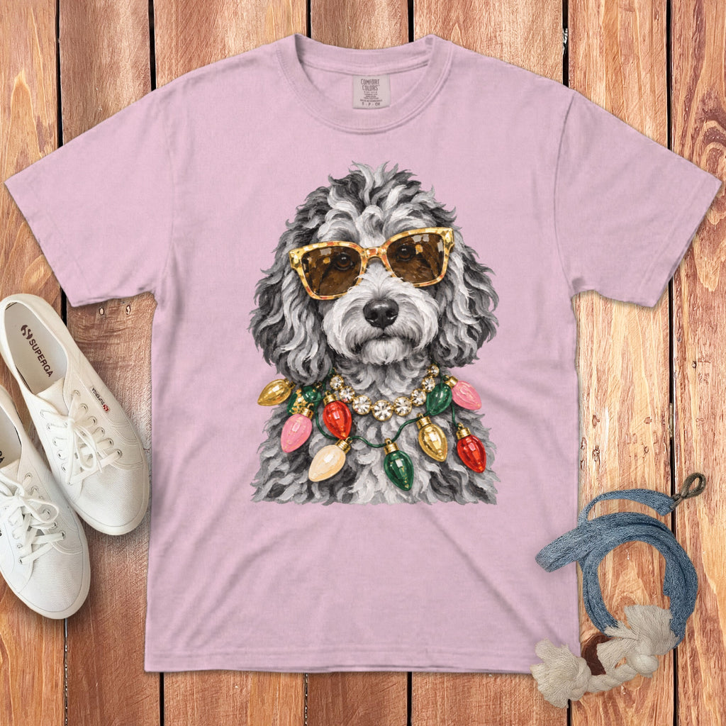 Pink t-shirt with a grey dog wearing sunglasses and a string of Christmas lights.