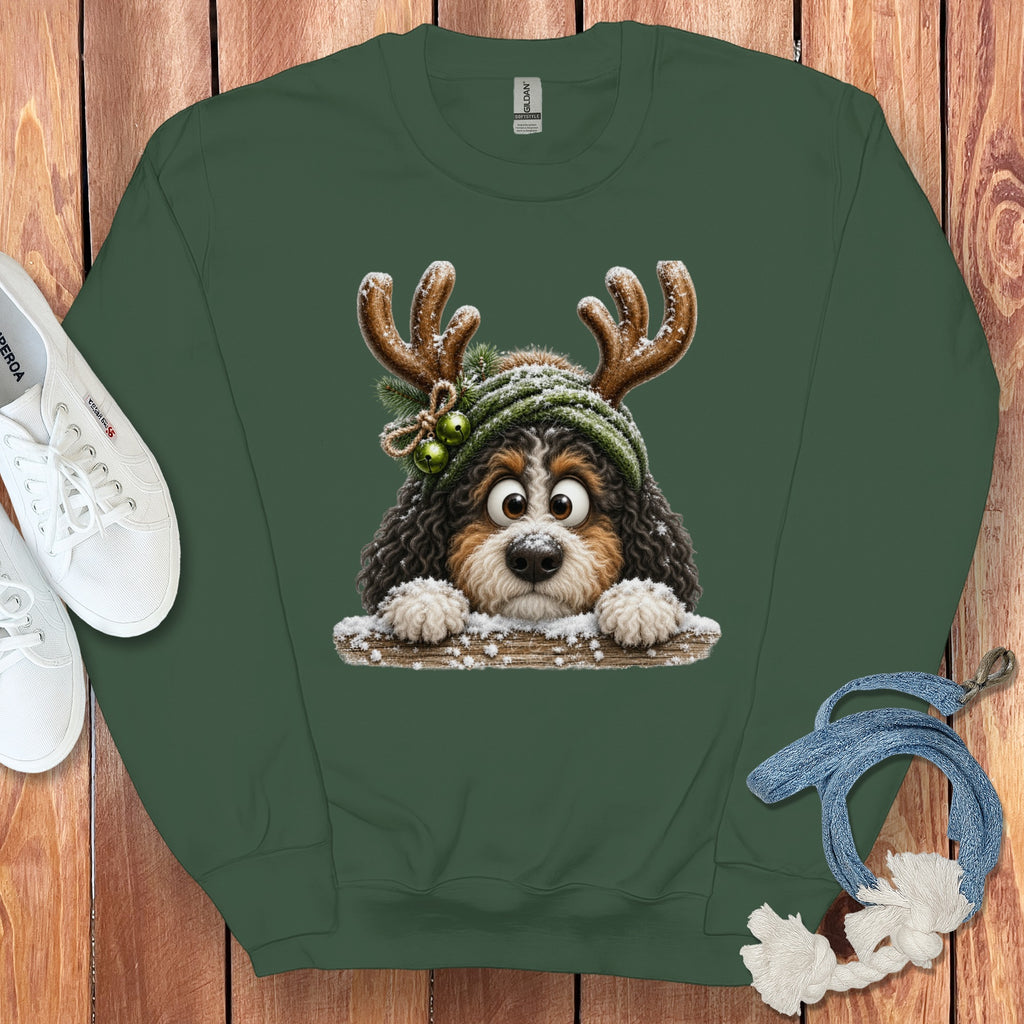 Dark green sweatshirt with a cartoon dog wearing reindeer antlers and a green hat.