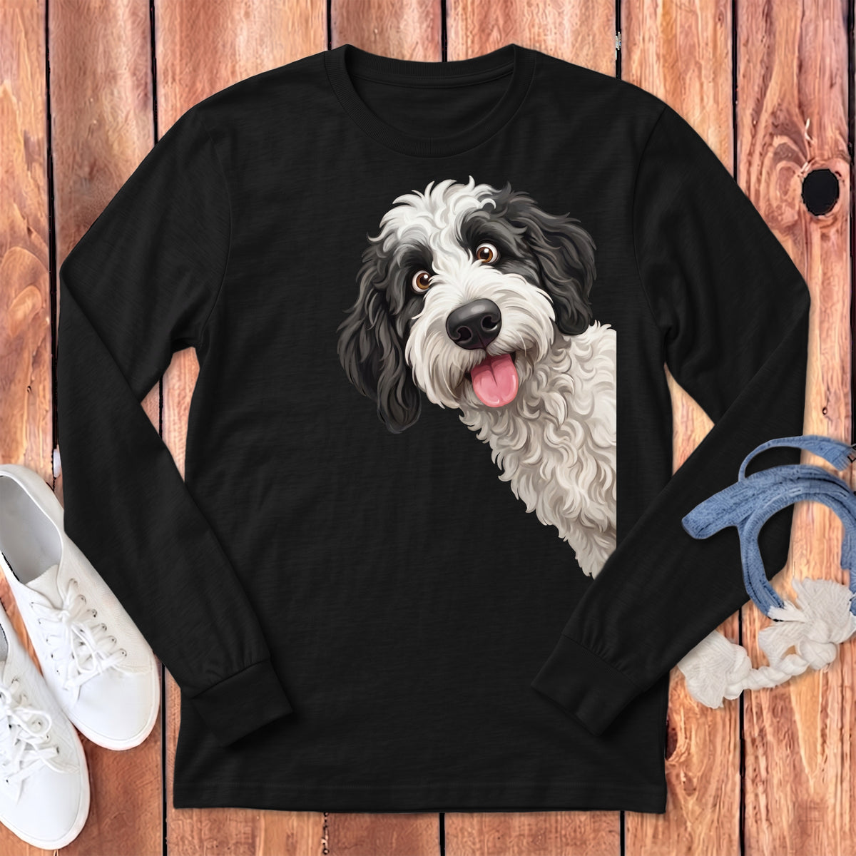 Black long sleeve shirt with a happy black and white dog peeking from the side.