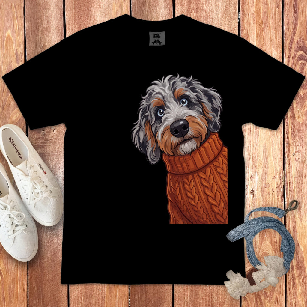 Black t-shirt with illustration of a dog wearing an orange cable-knit sweater.