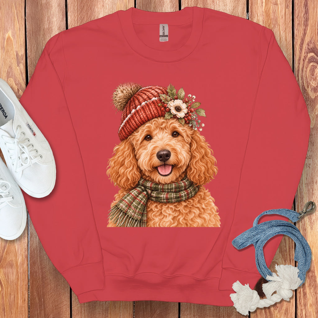 Red sweatshirt with a watercolor print of a dog wearing a winter hat and scarf.