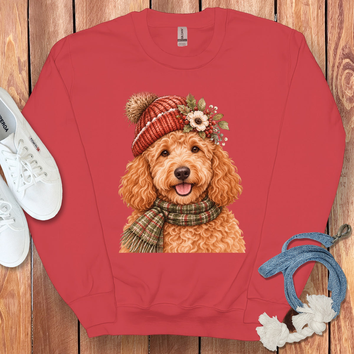 Red sweatshirt with a watercolor print of a dog wearing a winter hat and scarf.