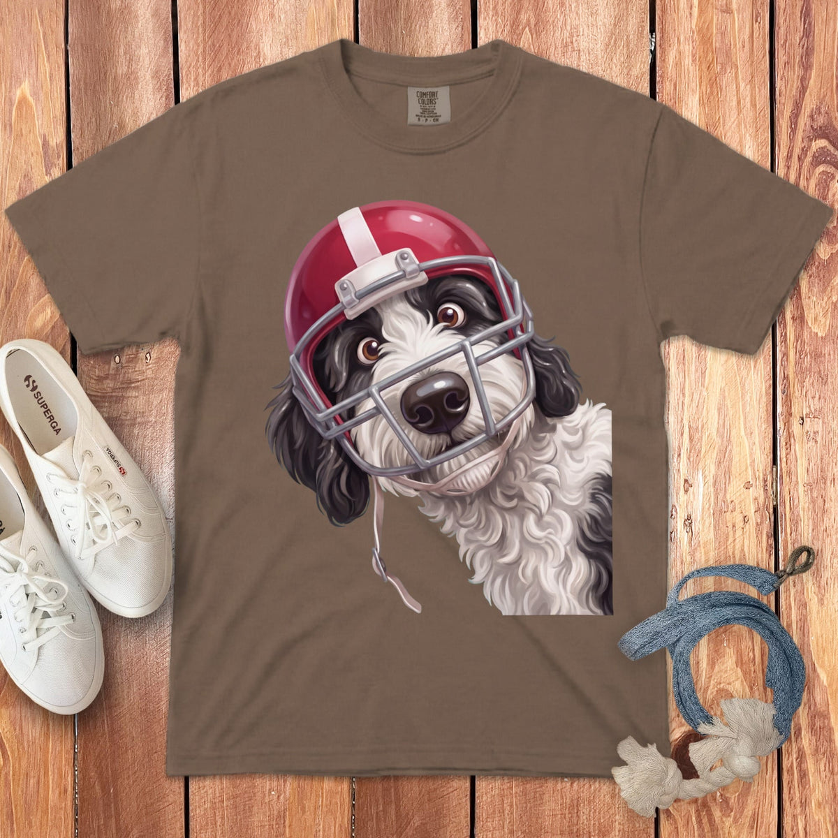 Brown t-shirt with illustration of a dog wearing a red football helmet.