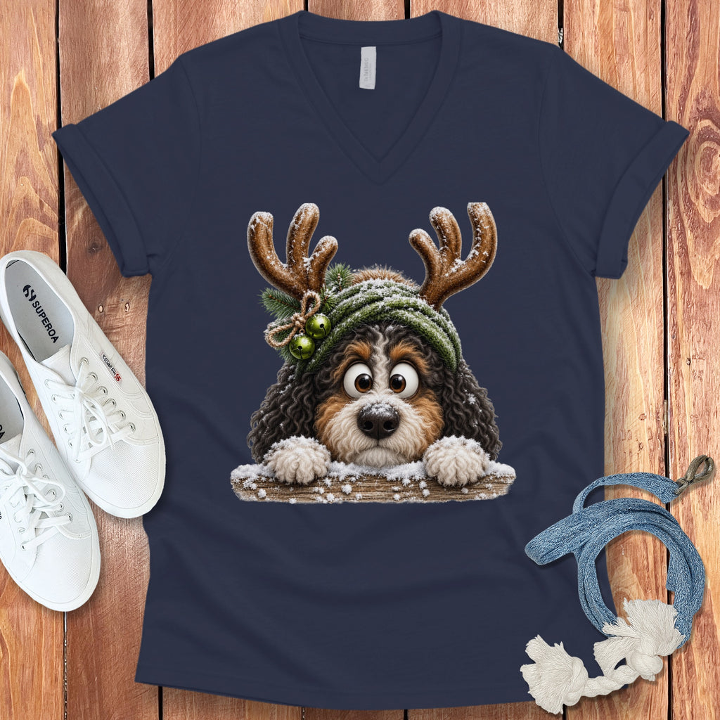 Navy v-neck t-shirt with cartoon dog wearing antlers and a green hat.
