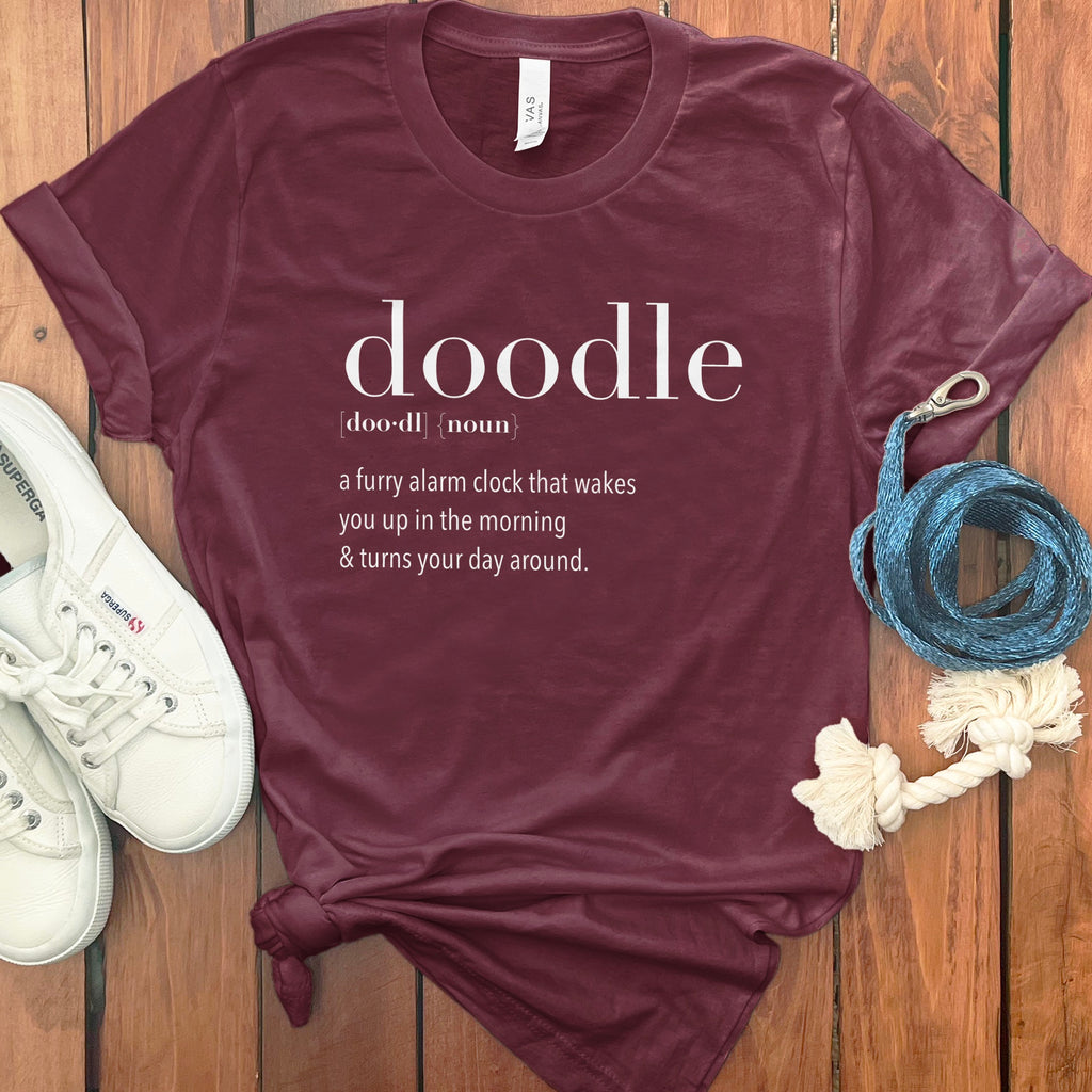 Maroon t-shirt with "doodle" definition: a furry alarm clock.