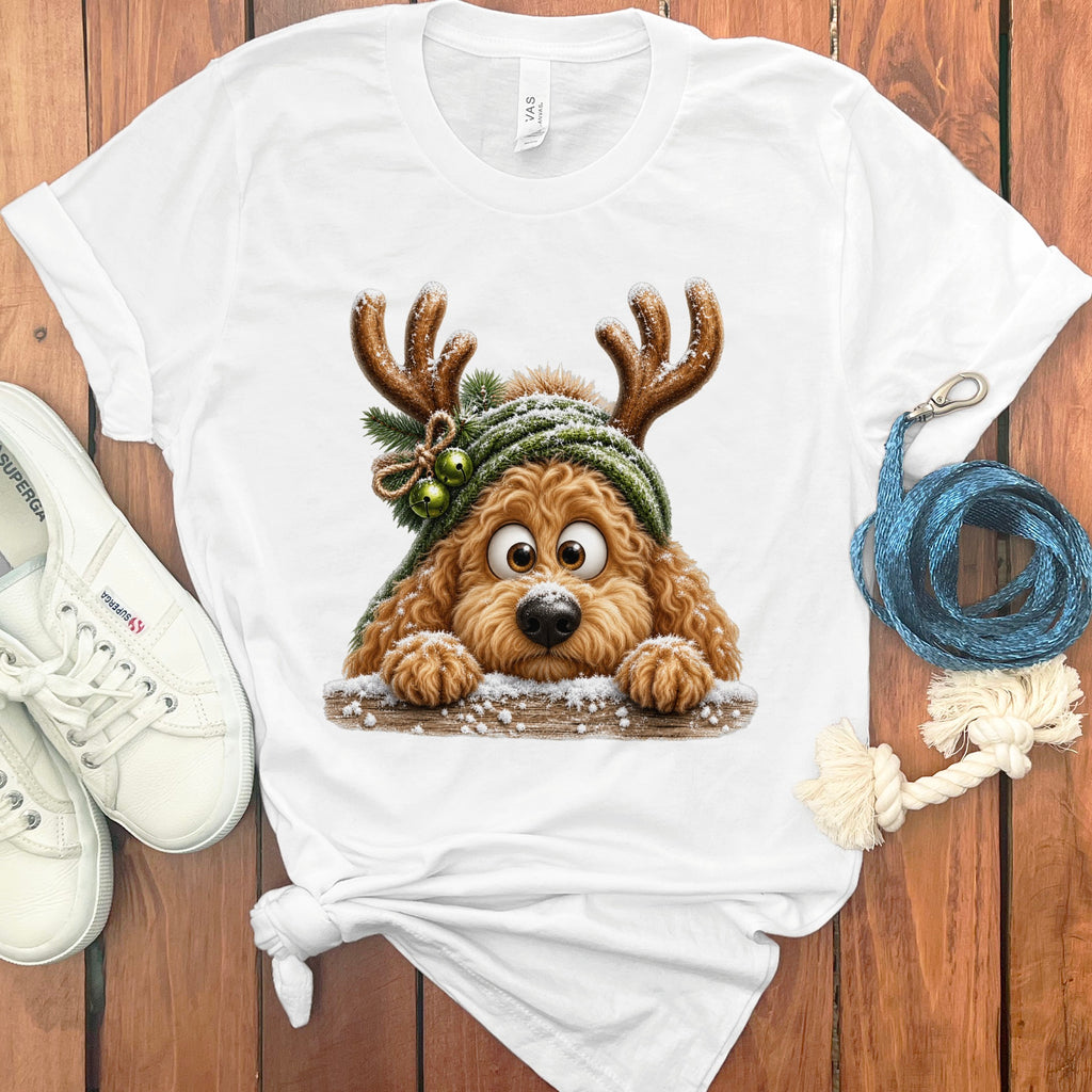 White t-shirt with graphic of a dog wearing reindeer antlers and a green hat.