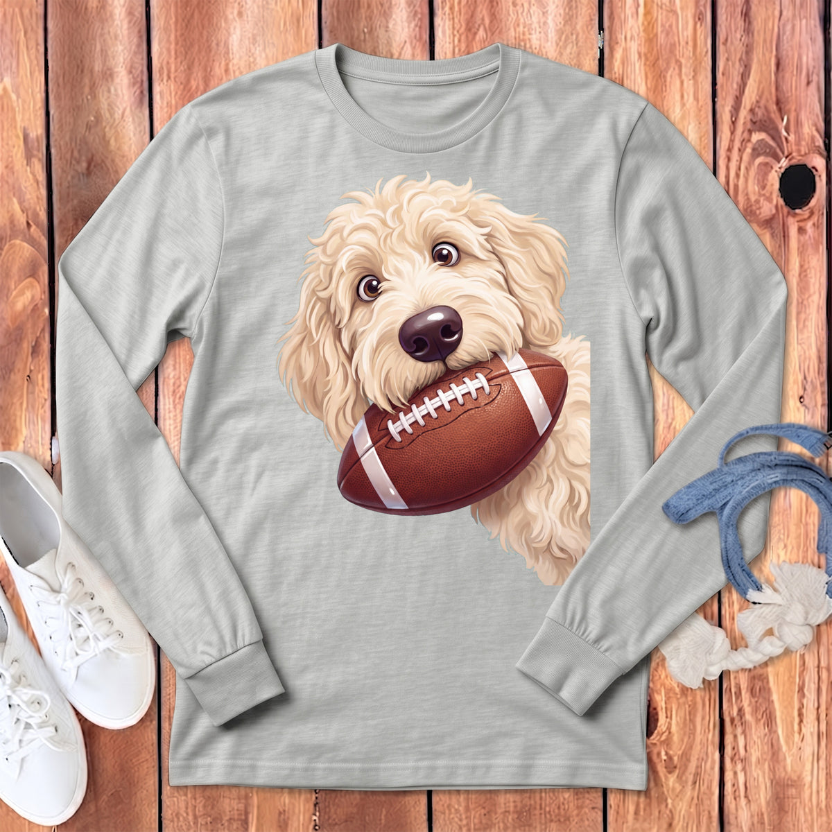 Light gray long sleeve shirt with a fluffy dog biting a football graphic.