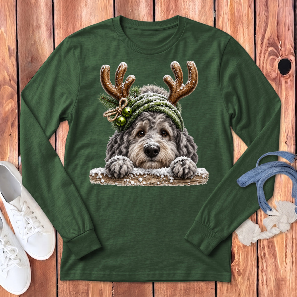 Green long sleeve shirt with a doodle dog wearing reindeer antlers and a winter hat.