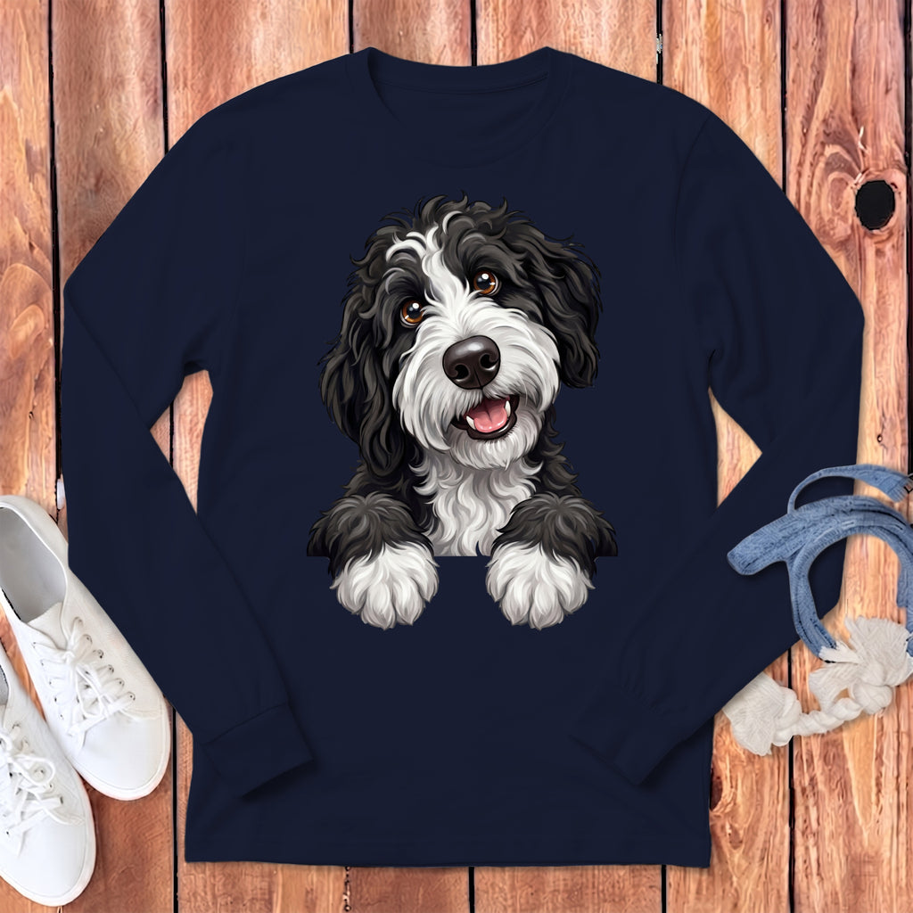 Illustration of a black and white Portuguese Water Dog with paws over a dark blue shirt.