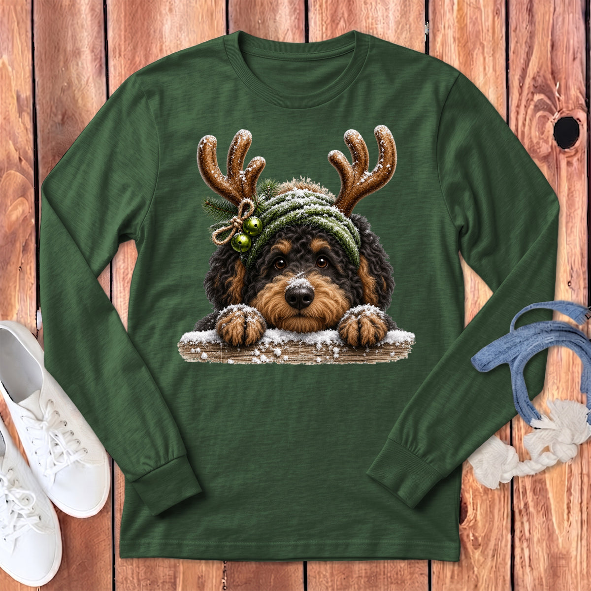 Green long-sleeve shirt with a doodle dog wearing reindeer antlers and a winter hat.