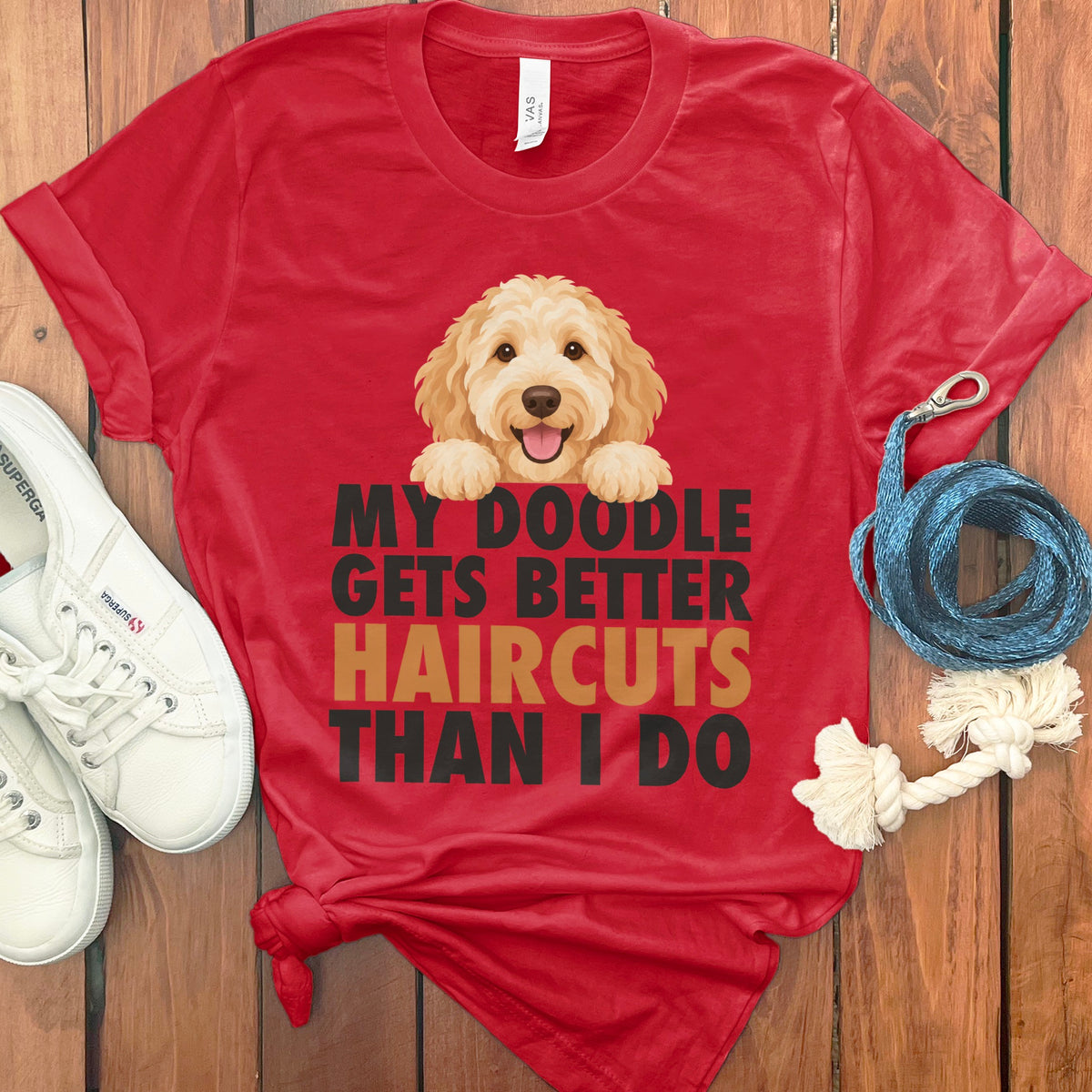Red t-shirt with a doodle dog graphic and the text "My Doodle Gets Better Haircuts Than I Do".