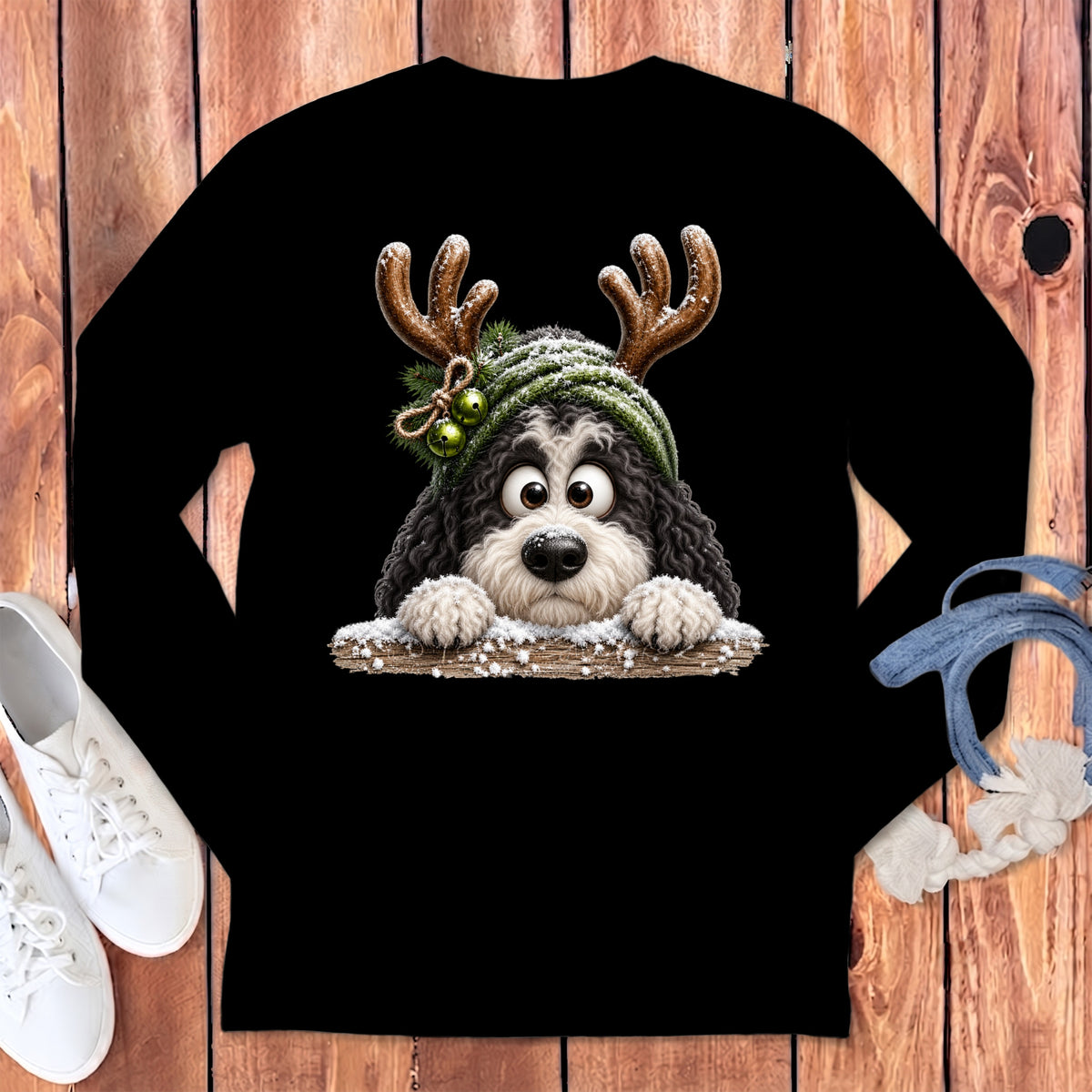 Black long-sleeve shirt with a cartoon dog wearing reindeer antlers and a beanie.