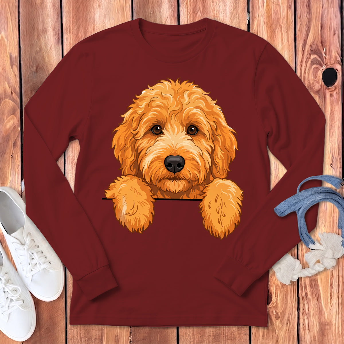 Maroon long-sleeve shirt with a golden doodle peeking over the chest.