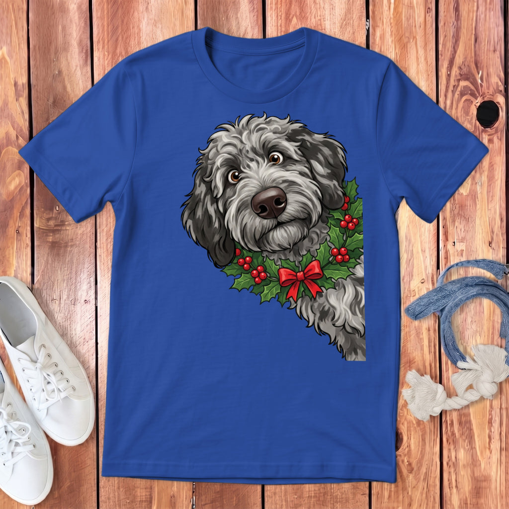 Blue t-shirt with a cartoon dog wearing a holly wreath and red bow.