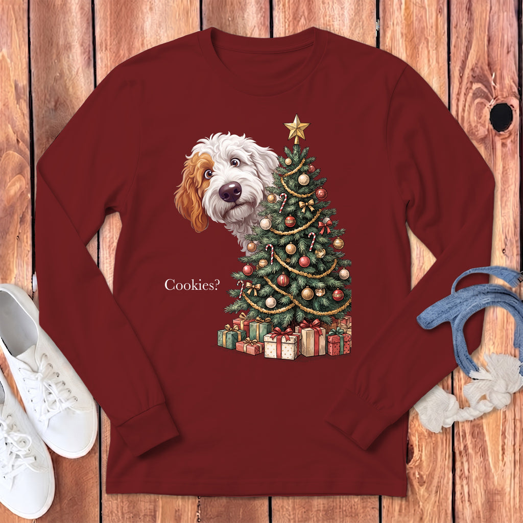 Maroon long sleeve shirt with a dog peeking from behind a Christmas tree and the text "Cookies?".