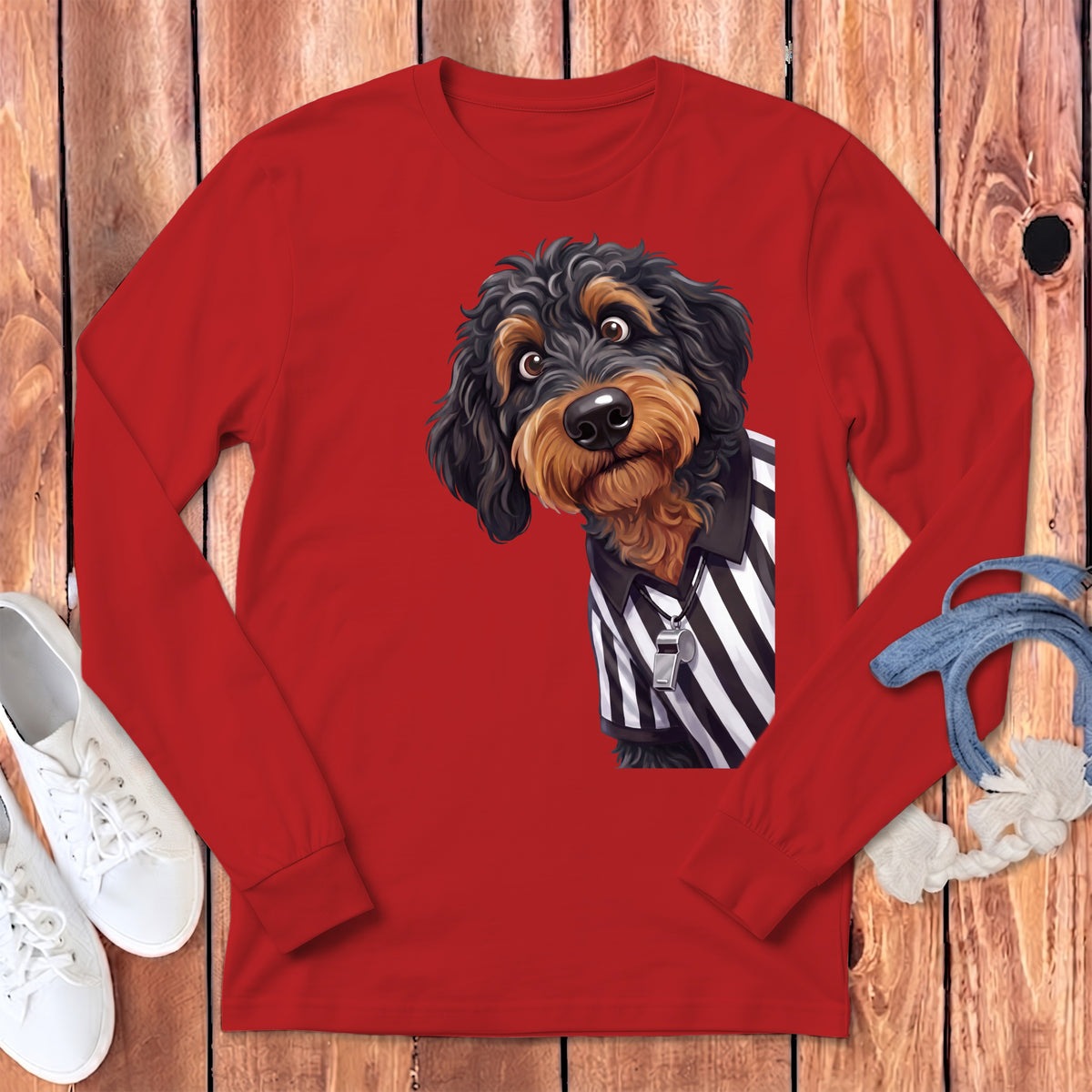 Illustration of a brown fluffy dog wearing a referee shirt and whistle on a red long-sleeve shirt.