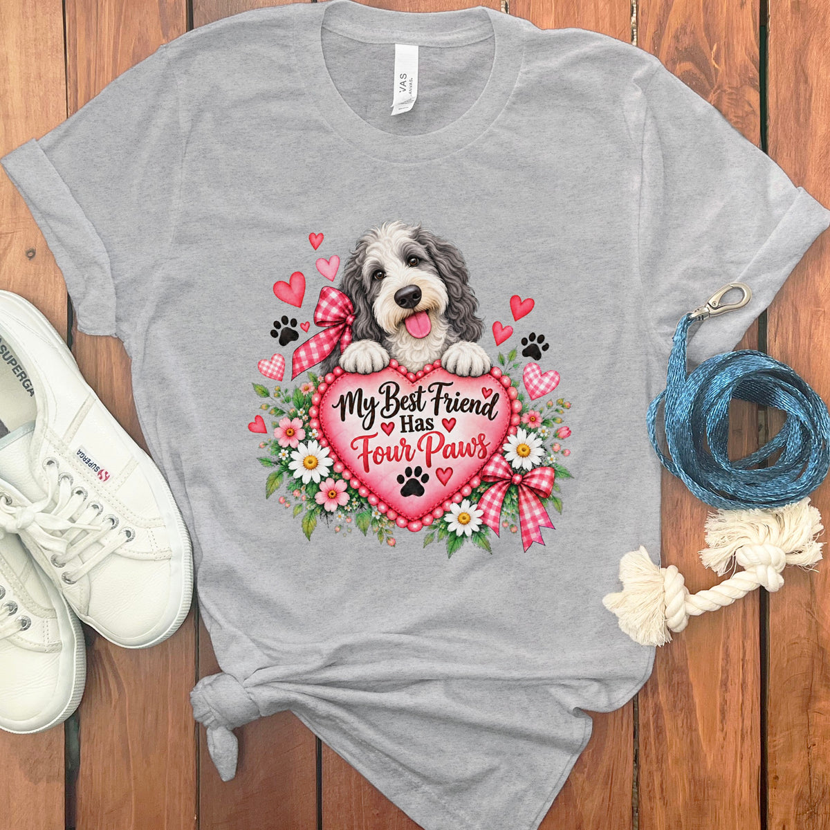 Heather gray t-shirt featuring a doodle dog behind a pink heart with the text My Best Friend Has Four Paws.