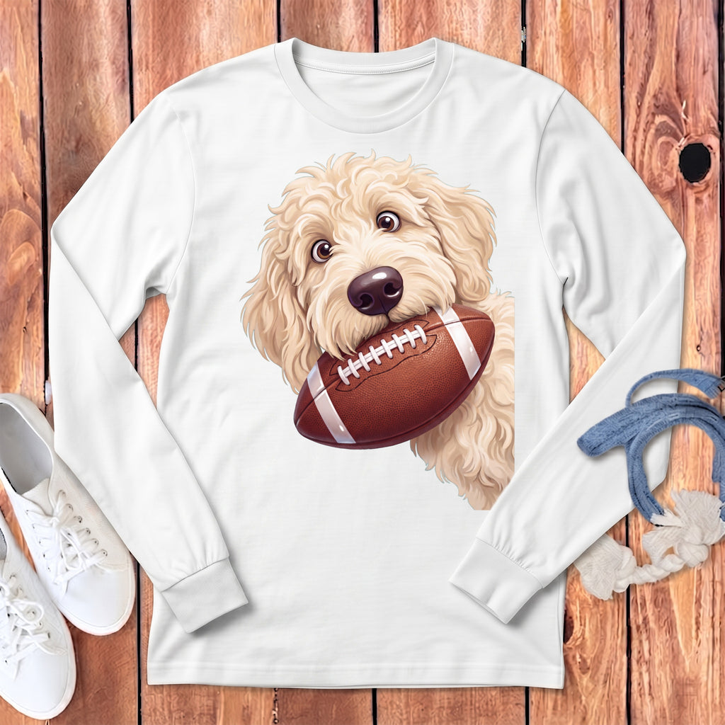 White long-sleeve shirt with a cream doodle dog holding a football.