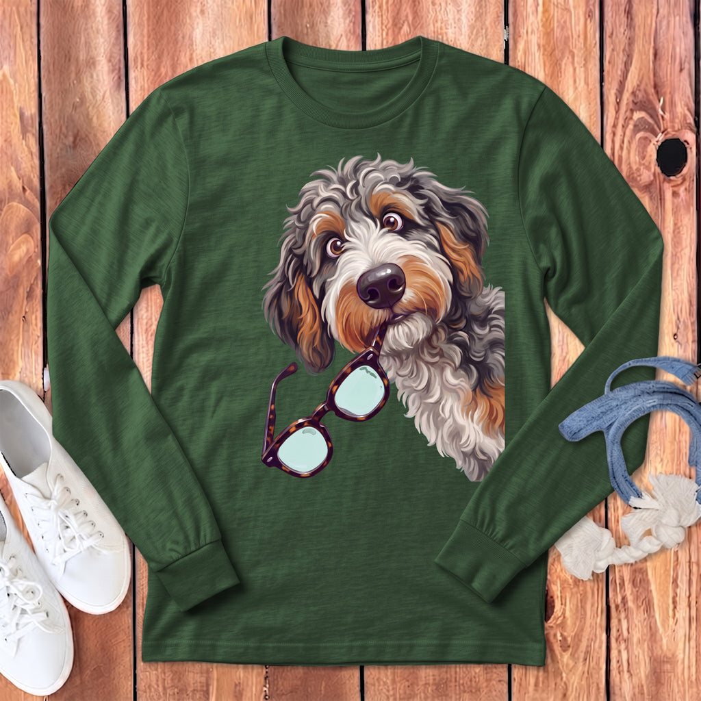 Dark green long-sleeve t-shirt featuring a graphic of a fluffy dog holding eyeglasses in its mouth.