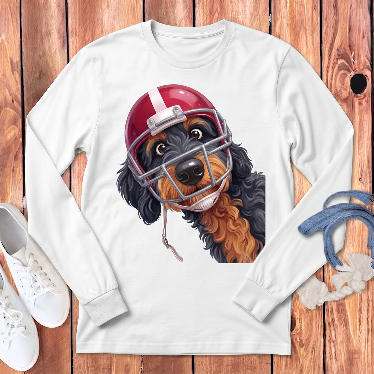 White long sleeve shirt with a cartoon dog wearing a football helmet and facemask.